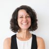 Happy successful woman posing with folded arms